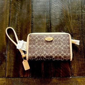 NWT - Coach small clutch (wallet/purse) with wrist band